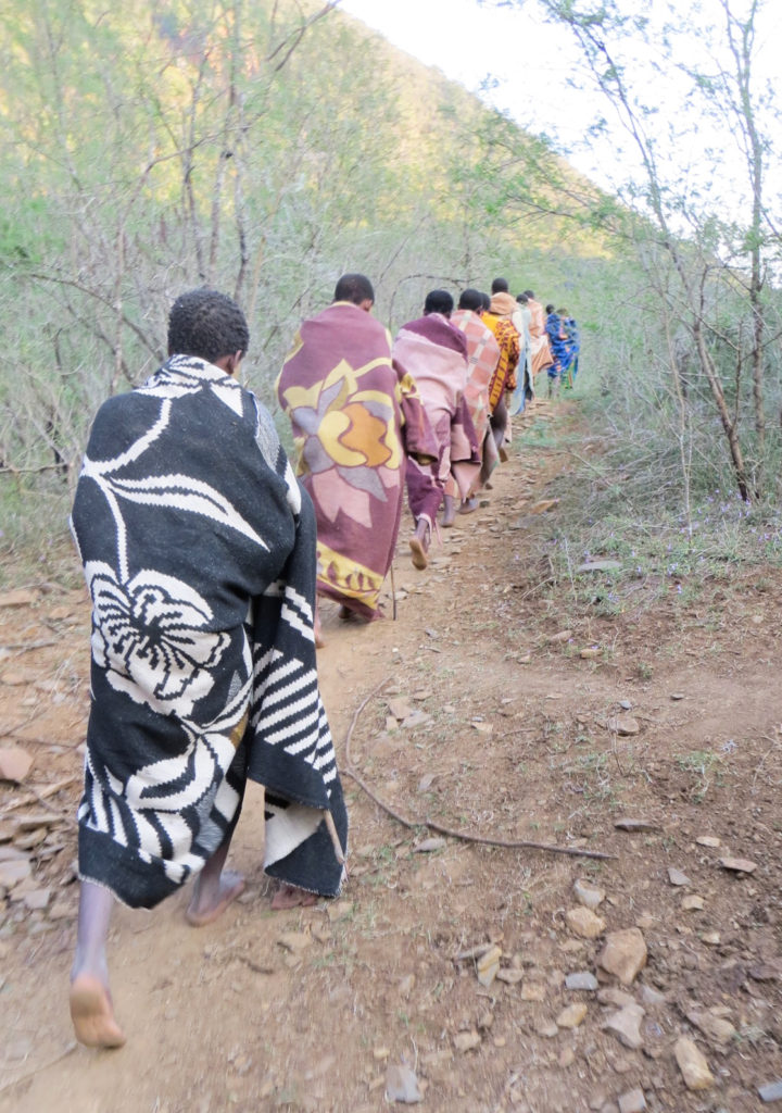 Xhosa walking through forest to their adulthood rite. They are neither boys nor men. (Photo by Dingeman)
